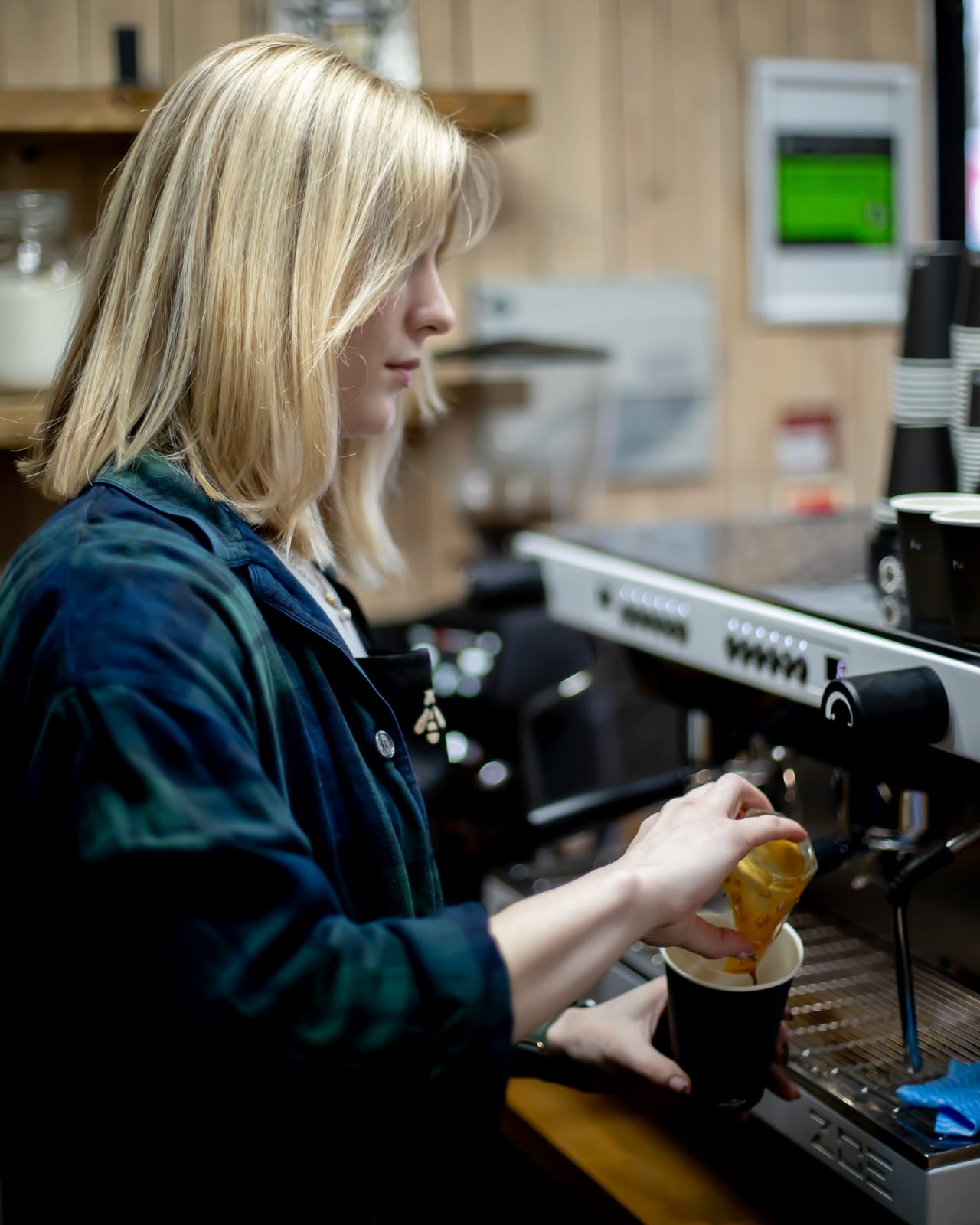 Bailey making a coffee at The Bee Hive Cafe