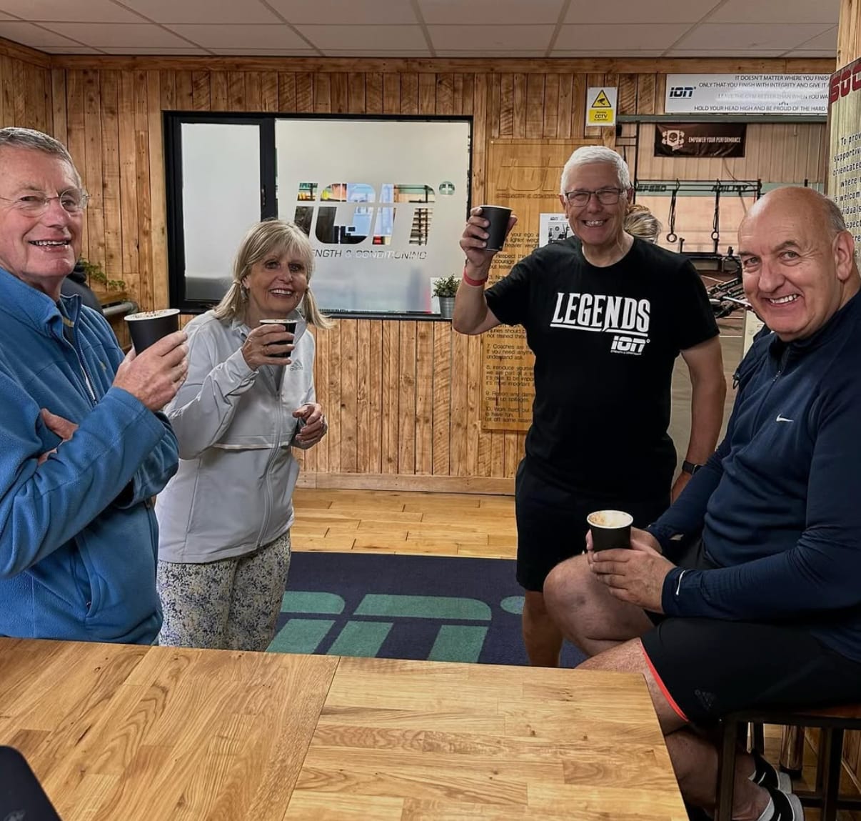 Group of friends enjoying coffee at The Bee Hive Cafe