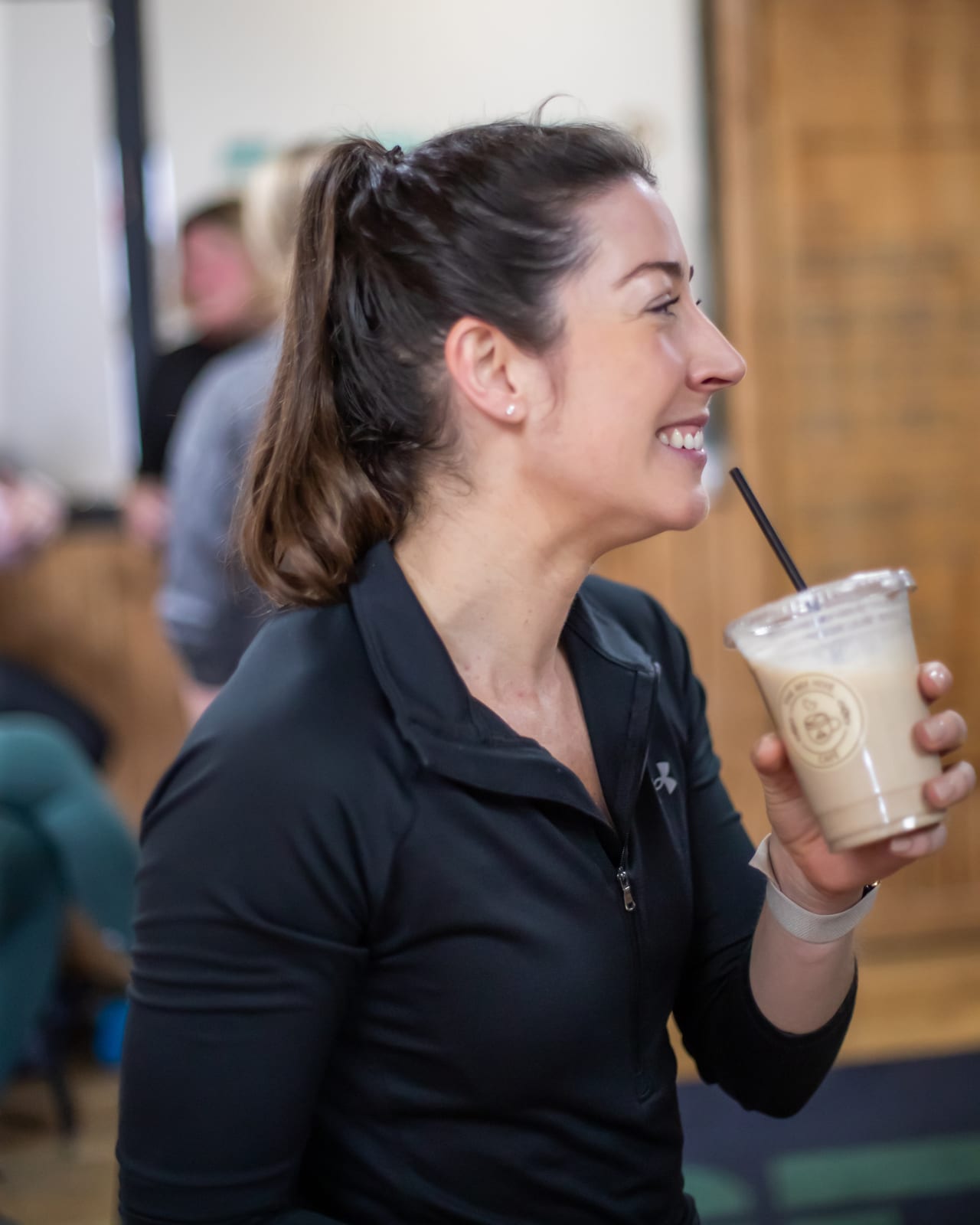 Customer with a protein shake at The Bee Hive Cafe